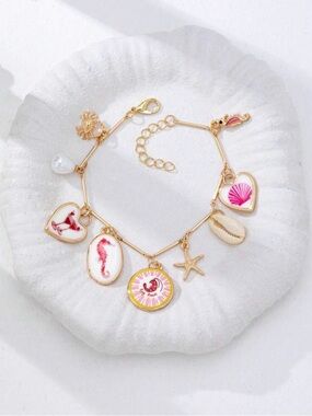 Gold Tone Sea Charm Bracelet with Pink Shell Accents